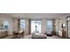 Open concept living room with hardwood floors, large windows, and contemporary furnishings at 126 4Th Ne Ave # 1302, St Petersburg, FL 33701