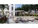 Cozy outdoor patio with stylish seating, a fire pit, and lush landscaping at 126 4Th Ne Ave # 1302, St Petersburg, FL 33701
