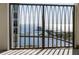 View from balcony with railings showing the calm water of the ocean and the beach and pier at 126 4Th Ne Ave # 1302, St Petersburg, FL 33701