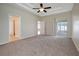 Large bedroom with carpet, access to a bathroom and sliding doors to a patio at 1655 Bonita Bluff Ct, Ruskin, FL 33570