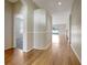 Hardwood floor hallway with access to other rooms at 1655 Bonita Bluff Ct, Ruskin, FL 33570