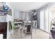 Small dining area with table and chairs near the kitchen at 225 35Th N St, St Petersburg, FL 33713