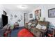 Living room with brown couch and small rug at 225 35Th N St, St Petersburg, FL 33713