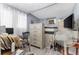 Simple bedroom with dresser, bed, and a desk area at 225 35Th N St, St Petersburg, FL 33713