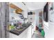 Small kitchen with white cabinets, appliances, and ample storage at 225 35Th N St, St Petersburg, FL 33713