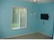 Bright bedroom with window and ceiling fan at 3161 Lake Pine S Way # B1, Tarpon Springs, FL 34688