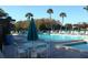 Community pool with spa and ample seating at 3161 Lake Pine S Way # B1, Tarpon Springs, FL 34688