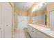 Main bathroom with double vanity, bathtub, and shower at 4305 Bayside Village Dr # 104, Tampa, FL 33615