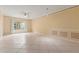 Large living area with tile floors and plenty of natural light at 4305 Bayside Village Dr # 104, Tampa, FL 33615