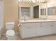 Double vanity bathroom with a bathtub and separate shower at 4305 Bayside Village Dr # 104, Tampa, FL 33615