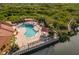 Community pool with lounge chairs and patio area, located on the water at 4305 Bayside Village Dr # 104, Tampa, FL 33615