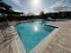 Community pool with plenty of lounge chairs at 4305 Bayside Village Dr # 104, Tampa, FL 33615