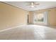 Bright living room with tile floors and sliding glass door at 4305 Bayside Village Dr # 104, Tampa, FL 33615