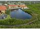 Aerial view of community with pond and boardwalk at 4305 Bayside Village Dr # 104, Tampa, FL 33615