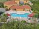 Community pool with plenty of lounge chairs and covered seating areas at 4305 Bayside Village Dr # 104, Tampa, FL 33615