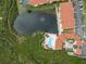 Aerial view of apartment complex with pool and pond at 4305 Bayside Village Dr # 104, Tampa, FL 33615