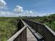 Elevated boardwalk with views of the surrounding nature at 4305 Bayside Village Dr # 104, Tampa, FL 33615