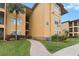 Condo building exterior with walkway and landscaping at 4305 Bayside Village Dr # 104, Tampa, FL 33615