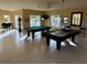 Well-lit game room featuring billiard tables and a piano at 4305 Bayside Village Dr # 104, Tampa, FL 33615