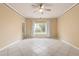 Spacious living room with tile flooring and large window at 4305 Bayside Village Dr # 104, Tampa, FL 33615