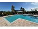 Inviting community pool area with patio furniture at 4305 Bayside Village Dr # 104, Tampa, FL 33615
