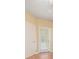 Room features wood flooring, neutral walls, and a door leading outside at 4305 Bayside Village Dr # 104, Tampa, FL 33615