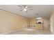 Spacious living room with tile floors and kitchen access at 4305 Bayside Village Dr # 104, Tampa, FL 33615