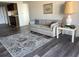 Living room with laminate floors and patterned rug at 450 Treasure Island Cswy # 601, Treasure Island, FL 33706