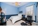 Bedroom with a queen bed, a recliner and large windows at 5944 Bay S Dr, Gulfport, FL 33707