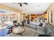 Gathering room with sectional sofa, large TV, and access to backyard patio at 5944 Bay S Dr, Gulfport, FL 33707