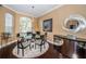 Bright dining room with a glass table and modern decor at 5944 Bay S Dr, Gulfport, FL 33707