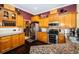 Spacious kitchen with stainless steel appliances and granite counters at 5944 Bay S Dr, Gulfport, FL 33707