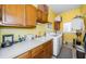 Laundry room with washer, dryer, cabinets, and a sink at 5944 Bay S Dr, Gulfport, FL 33707