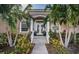 Inviting home exterior with lush landscaping and double front doors at 5944 Bay S Dr, Gulfport, FL 33707