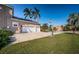 Three-car garage with driveway and basketball hoop at 5944 Bay S Dr, Gulfport, FL 33707