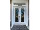 Elegant double front doors with glass panels and decorative wreaths at 5944 Bay S Dr, Gulfport, FL 33707