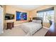 Cozy bedroom with a comfortable bed and a wall-mounted TV at 5944 Bay S Dr, Gulfport, FL 33707
