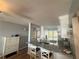 Kitchen boasts granite countertops and white cabinets at 6268 Palma Del Mar Blvd S # 215, St Petersburg, FL 33715