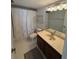 Bathroom with single sink vanity, shower/tub combo, and linen closet at 6268 Palma Del Mar Blvd S # 215, St Petersburg, FL 33715