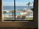 View from bedroom window shows resort-style pool and bay at 6268 Palma Del Mar Blvd S # 215, St Petersburg, FL 33715