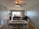 Bright dining room with white table and chairs, overlooking patio and water views at 6268 Palma Del Mar Blvd S # 215, St Petersburg, FL 33715