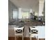 Modern kitchen with granite countertops and white cabinets at 6268 Palma Del Mar Blvd S # 215, St Petersburg, FL 33715