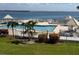 Community pool with water views and patio seating at 6268 Palma Del Mar Blvd S # 215, St Petersburg, FL 33715