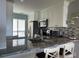 Updated kitchen features granite countertops, stainless steel appliances, and white cabinets at 6268 Palma Del Mar Blvd S # 215, St Petersburg, FL 33715