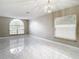 Living room with marble floors and large window at 6702 Mirror Lake Ave, Tampa, FL 33634