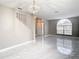 Open dining room with marble floors and chandelier at 6702 Mirror Lake Ave, Tampa, FL 33634