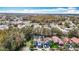 Aerial view showcasing a residential neighborhood with various house styles at 6702 Mirror Lake Ave, Tampa, FL 33634