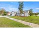 House exterior showcasing a well-maintained lawn and landscaping at 8404 Millwood Dr, Hudson, FL 34667