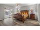 Spacious bedroom with wood-look flooring and access to a patio at 8404 Millwood Dr, Hudson, FL 34667