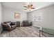 Living room features wood-look flooring and a ceiling fan at 8404 Millwood Dr, Hudson, FL 34667